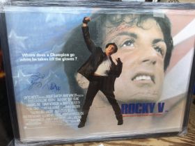 A framed and glazed multi signed Rocky V poster si
