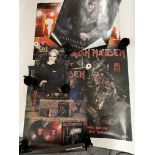 A collection of promotional Iron Maiden and Ozzy Osbourne posters