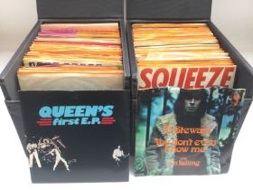 Three record cases containing 7inch singles and EP