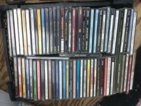 Three trays of CDs by various artists including Qu