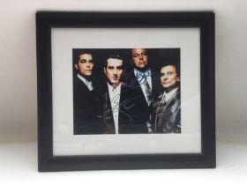 A framed and glazed signed photo of the four main
