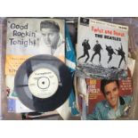 A box of 7inch singles and EPs by artists from the