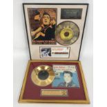 Two framed and glazed Elvis Presley gold discs com