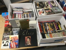Three boxes of mainly Elvis Presley CDs and DVDs i