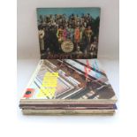 A bag of Beatles and related LPs including early U
