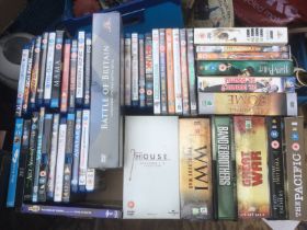 Five boxes of DVDs and BluRays comprising various