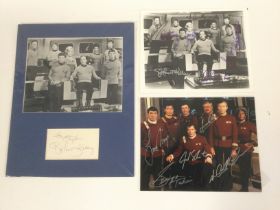 A collection of signed publicity cards and stills