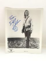 An unframed signed photo of David Carradine as Cai