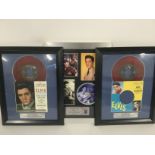 Two framed and glazed coloured vinyl Elvis Presley