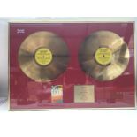 A framed and glazed BPI double gold disc presented