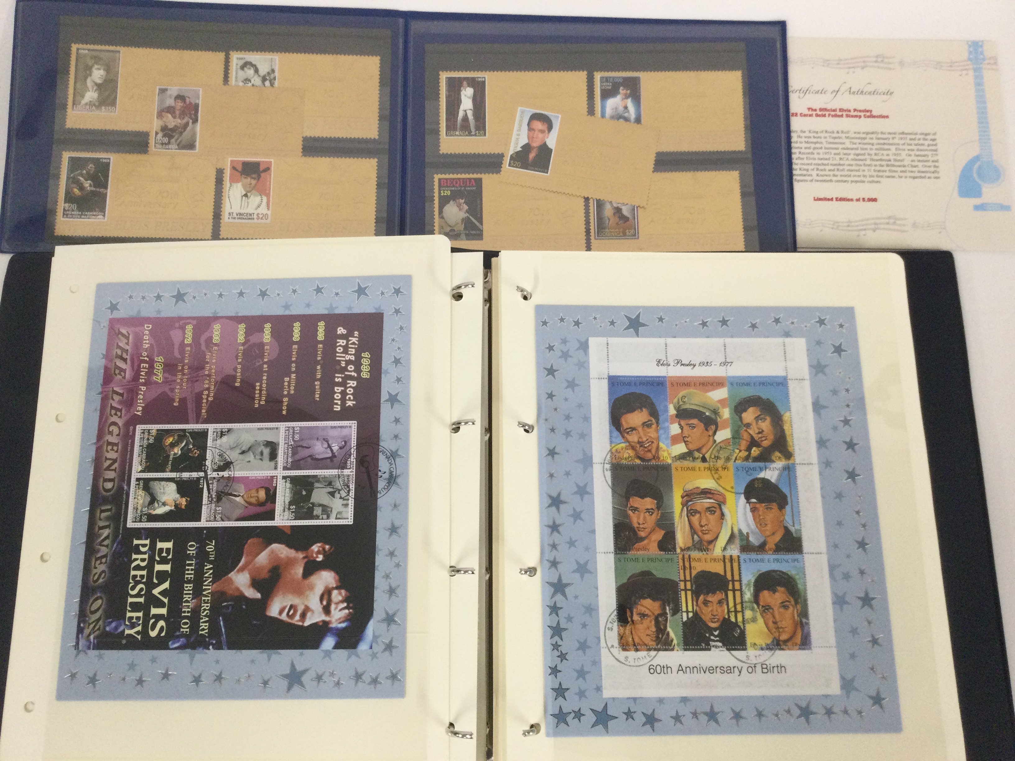 A collection of Elvis Presley stamps in two binder