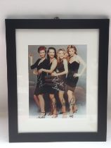 A framed snd glazed multi signed photo of the four