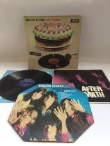 Three early UK pressings of Rolling Stones LPs com