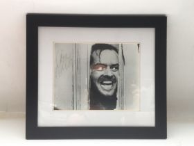 A framed and glazed signed photo of Jack Nicholson