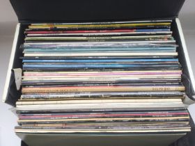 A record case and a bag of LPs by various artists