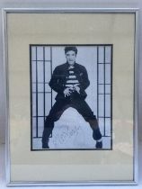 A framed and glazed signed photo of Elvis Presley,