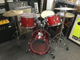 A Tama drumkit including a 20" bass drum, a black