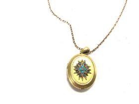 A Victorian locket inset with turquoise on a 9ct g