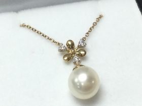 A 9ct yellow gold cultured pearl and diamond icycl