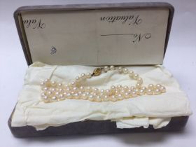 A boxed pearl necklace with a 9ct gold clasp.