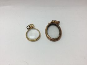 One 9ct gold locket and one yellow metal locket. A