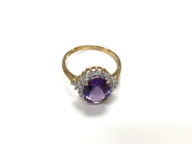 A 9ct gold ring set with amethyst. Size M and 2.22