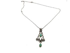 A necklace inset with turquoise and seed pearls. 4
