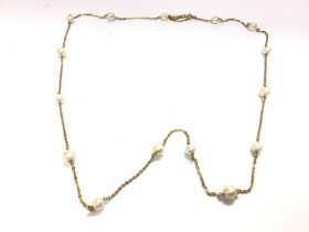 An 18ct gold necklace with pearls. 20.70g and 78cm