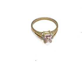 A 9ct gold ring set with pink gemstone. Size M and