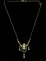An Edwardian necklace with central drop diamonds a