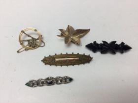 Five Edwardian brooches including 9ct gold brooche