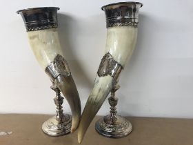 Two WMF horn vases with applied classical mounts .
