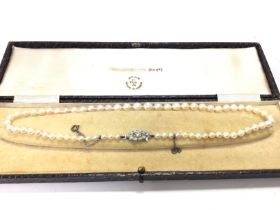 A simulated pearl necklace , postage category A