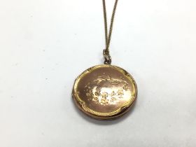 A 9ct gold chain with locket. 6.02g Postage A