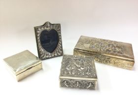 Silver hallmarked boxes, a silver frame and a non