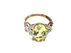 A 9ct gold ring set with large pale Green central