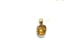 An 18ct gold pendant set with a citrine. 1.85g Pos