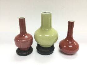 Three small Oriental vases, largest approx 14cm in