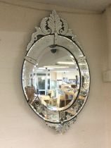 A Venetian glass wall mirror, approx height 93cm. Shipping category D.