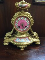 A French gilt mantle clock of classical style inse