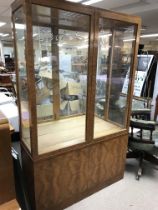 A large Walnut mirrored three shelf display cabine