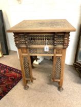 An antique Moorish side table with turned bobbin d