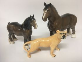 Two Beswick ceramic models of Heavy horses and Lio