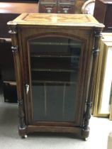 A Victorian walnut music cabinet with inlaid desig