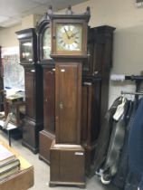 An oak long cased 30 hour clock, the brass dial wi