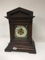 A Walnut cased early 20th century mantel clock. Hi