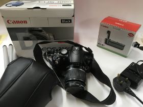 A canon dos 300d with had case, box, charger, batt