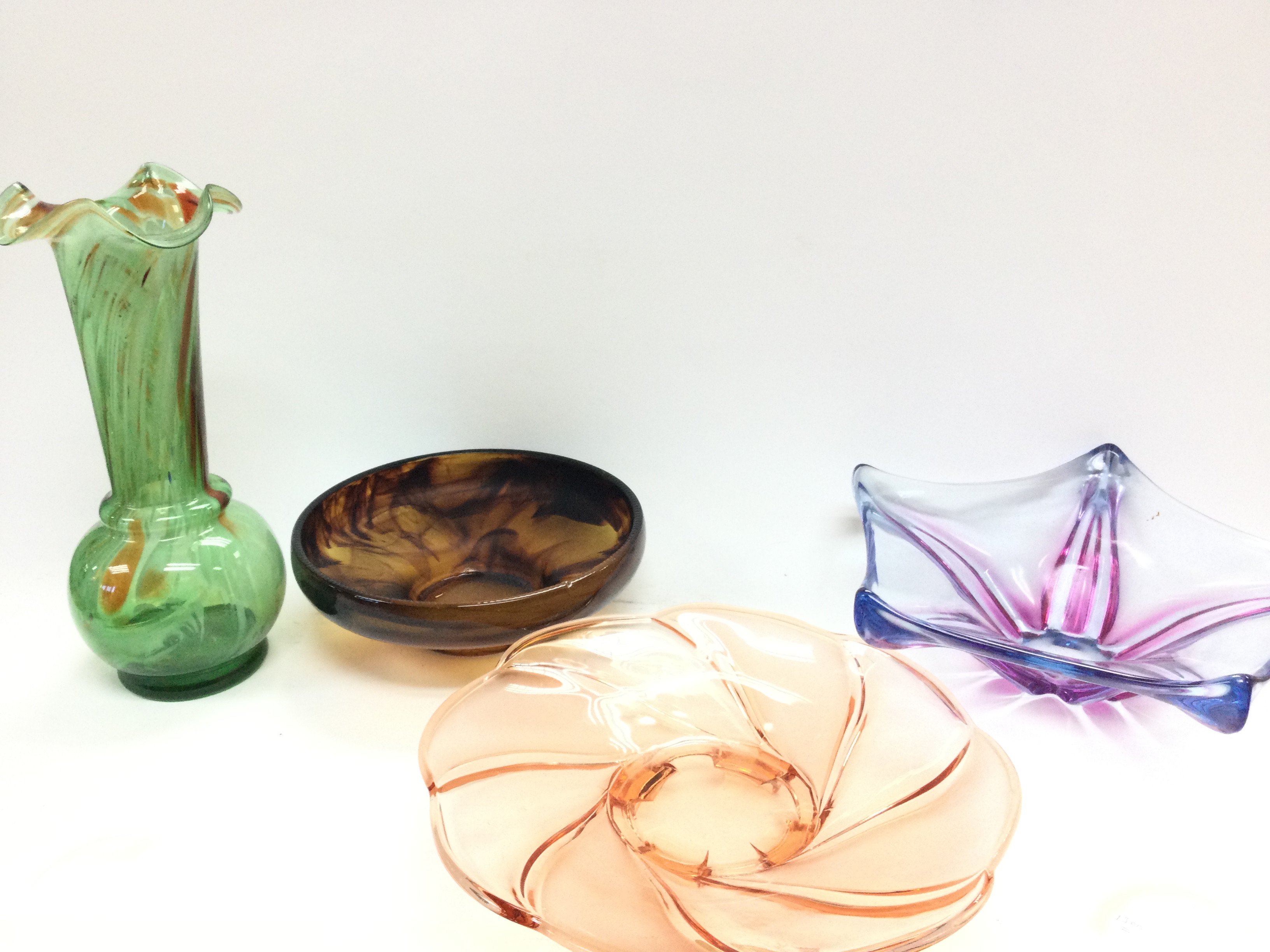 A collection of coloured art glass dishes and a va