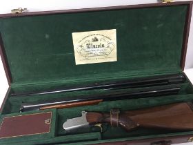 A cased 12bore Lincoln shotgun with an engraved ac