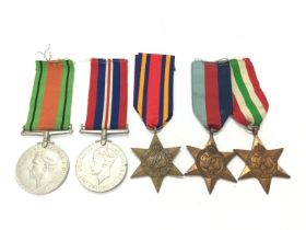 A collection of Five British medals. Postage categ